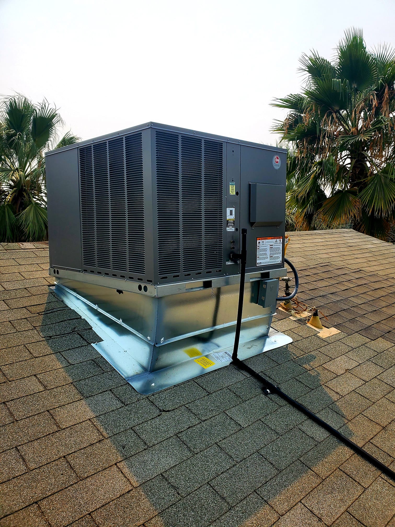 Ruud rooftop HVAC package unit installed by Fahrenheit Heating and Cooling
